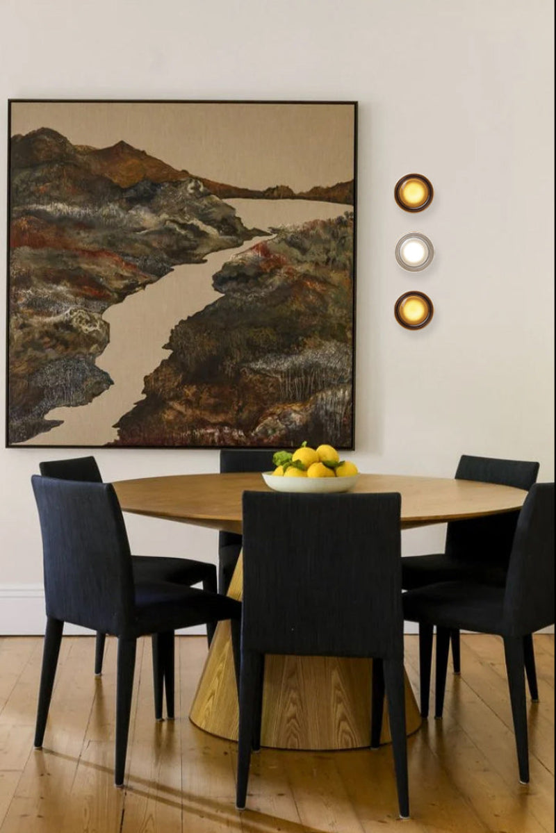 Bundle C: 2 grey and 1 frost wall light next to art work in a dining pace. 