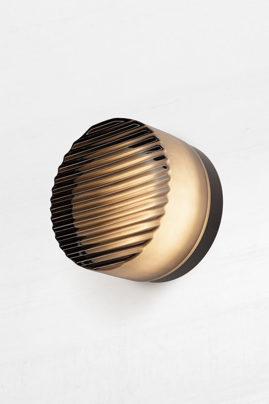 diffuser within shade softens the LED light, creating a gentle, glowing orb effect.