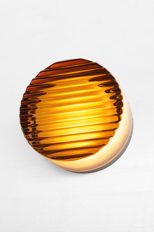 Dome shaped diffuser within shade softens the LED light, creating a gentle, glowing orb effect.