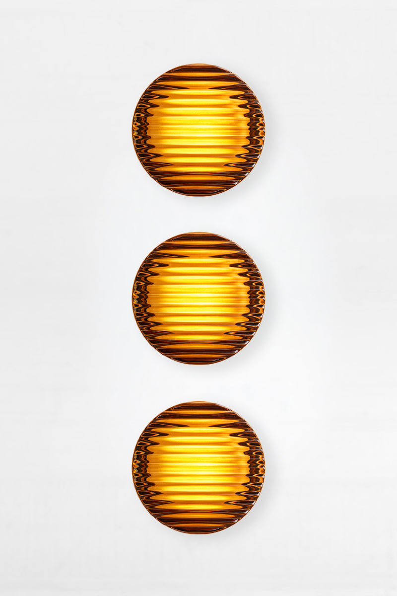 Triple amber Laval Dimple Glass LED Wall Sconce bundle with vertically stacked amber ribbed glass shades and warm glowing LED light.