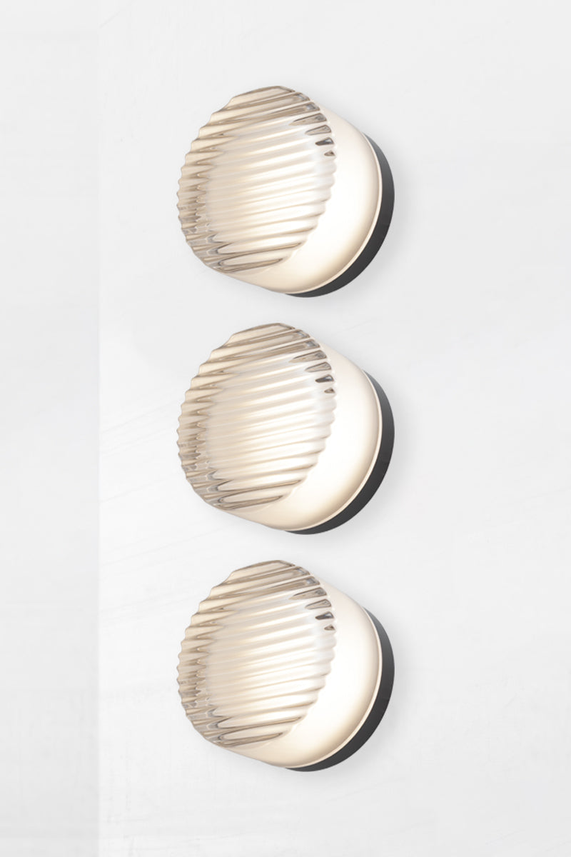 Triple frosted white Laval Dimple Glass LED Wall Sconce side profile highlighting sculptural layered ribbed glass and minimalist wall mounting design.