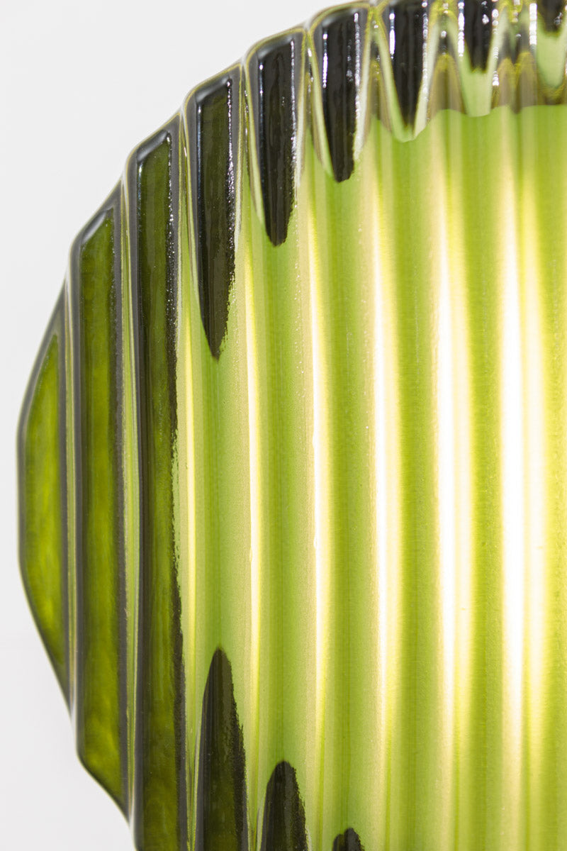 Close up of the Green ribbed LED wall light shown with light illuminated.