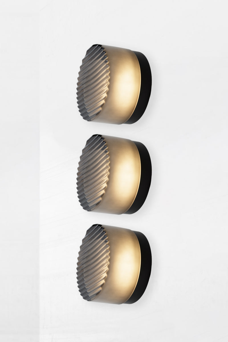 Side profile image of triple smoked grey Laval Dimple Glass LED Wall Sconce configuration highlighting layered ribbed glass detail and black wall mounts.