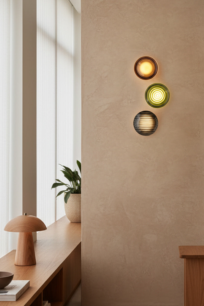 Mix A wall-mounted bundle of 3 on a beige wall with a window and plant in the background