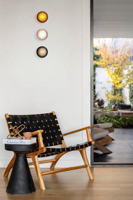 Bundle A: 3 x solid glass LED lights in three finishes as a wall feature above a reading nook. 