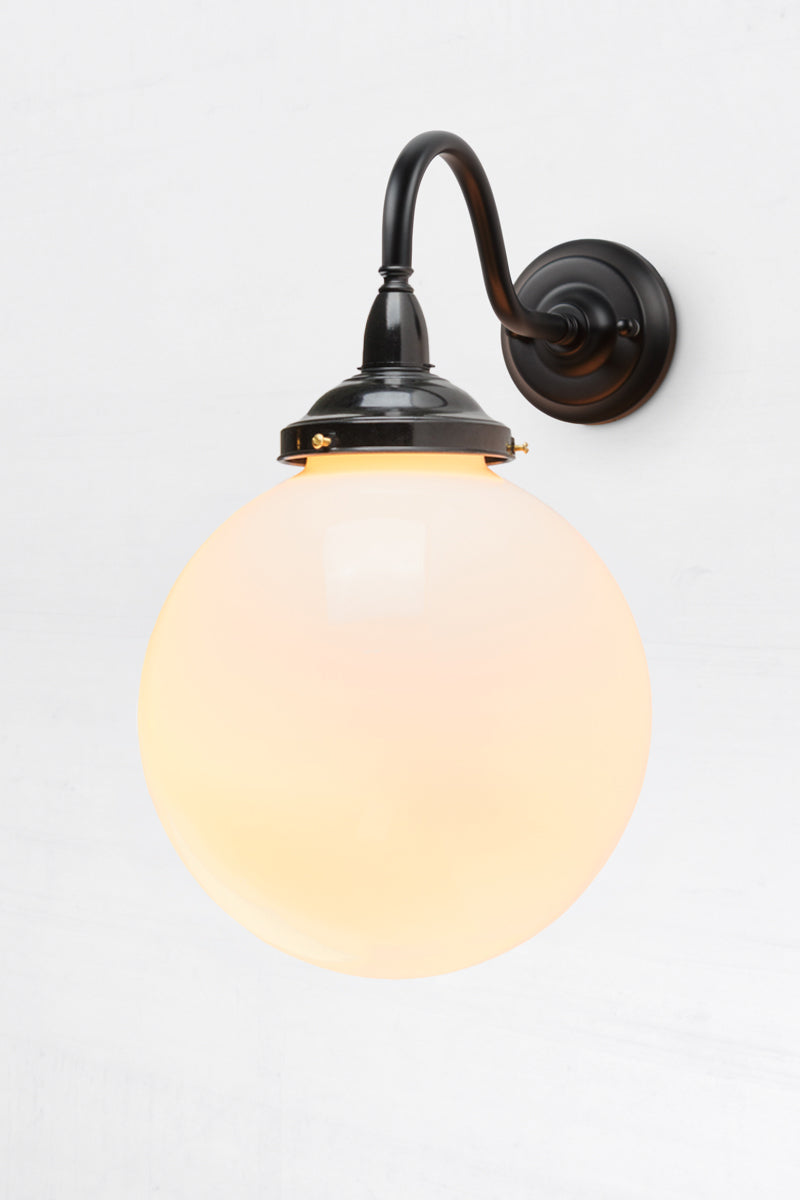 Black gooseneck outdoor wall light with a bakelite gallery and medium opal glass ball shade. 