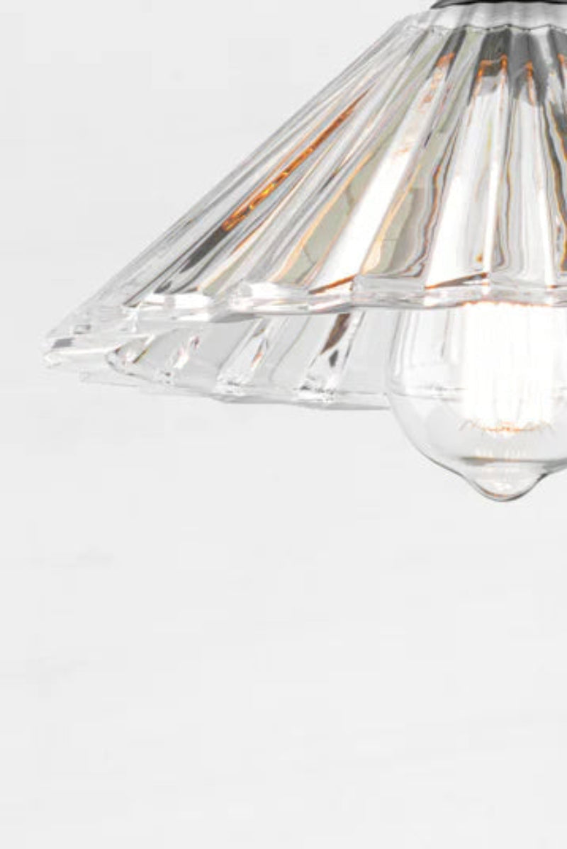 Close up of the Paris Pleated Glass shade, with a teardrop bulb. 