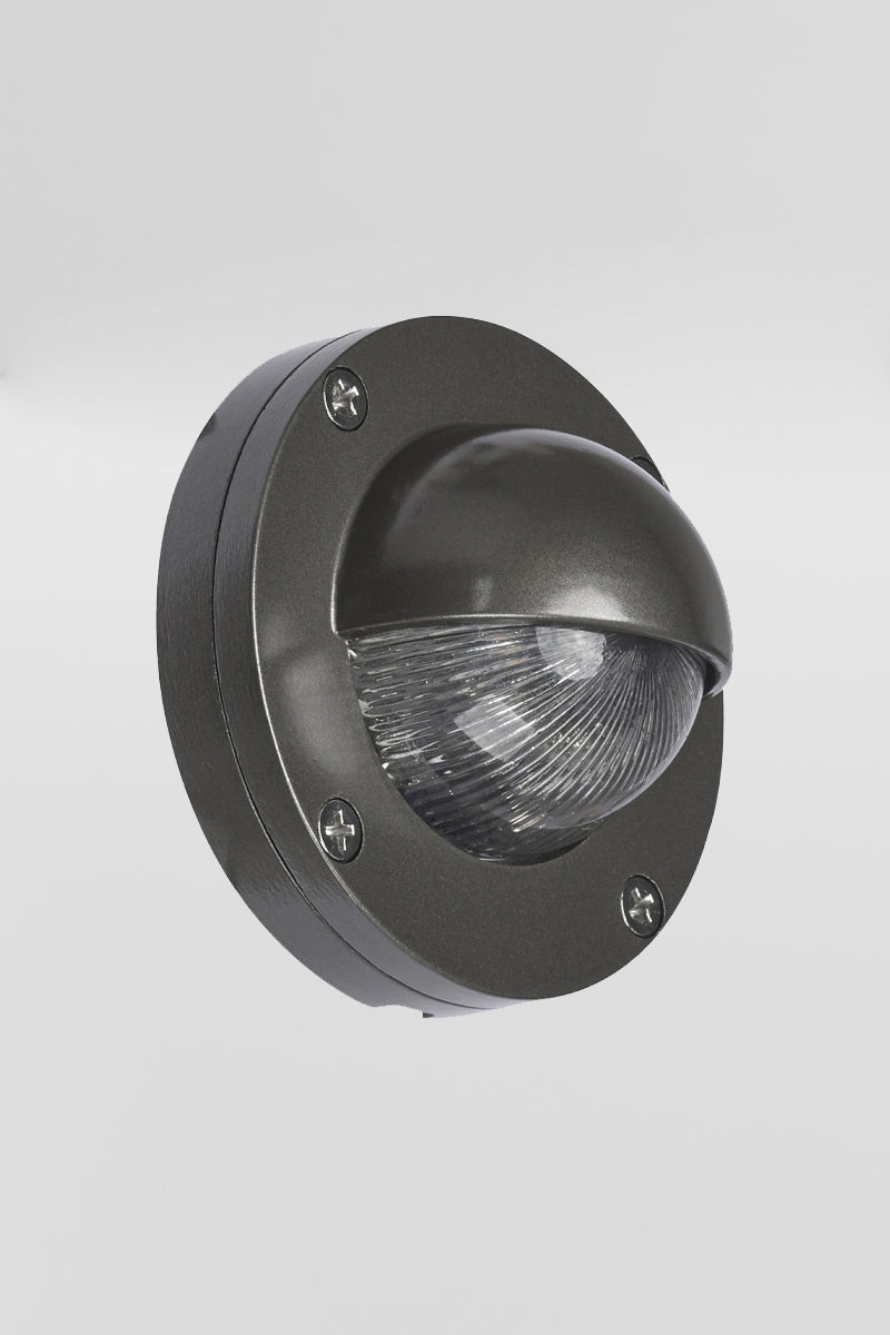 Charcoal coloured eyelid step light, with LED light source. 