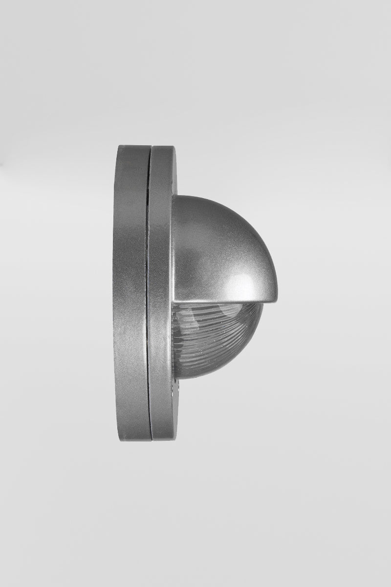 Side view of the silver finished eyelid step light, with LED light source. 