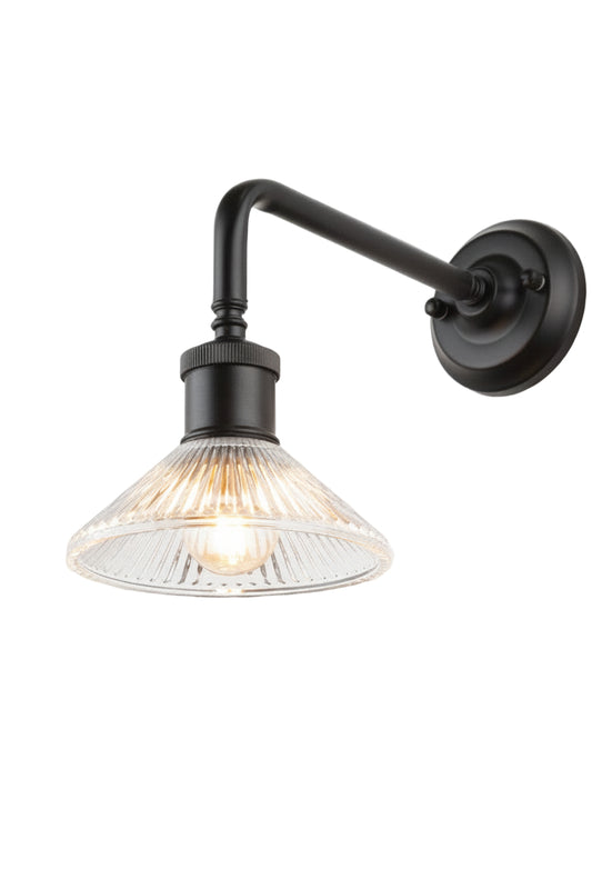 Side view of the clear pleate glass shade on the black 90 degree outdoor wall sconce. 