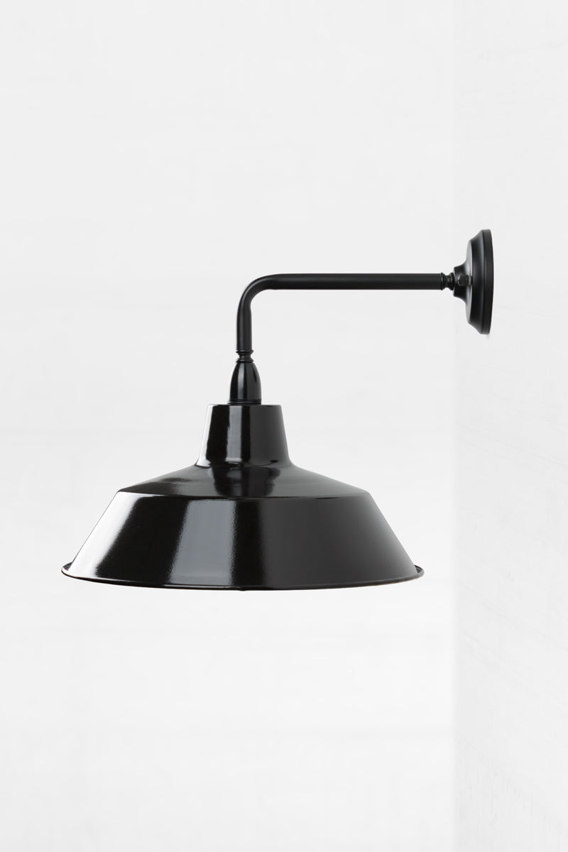 Side view of the 90 Degree outdoor wall sconce with a black steel shade. 