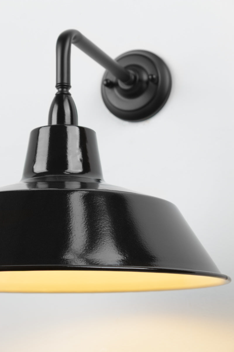 Close up of the 90 Degree outdoor wall sconce with a black steel shade. 