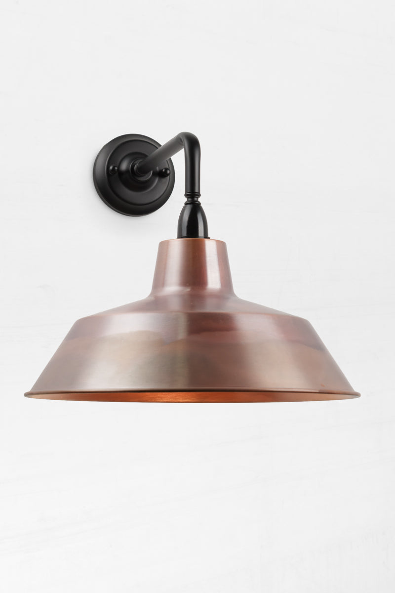 90 Degree outdoor wall sconce with an Aged Solid Copper shade. 