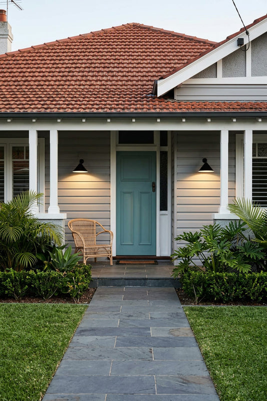 cone outdoor wall lights with black shades on a federation style house. on the front porch