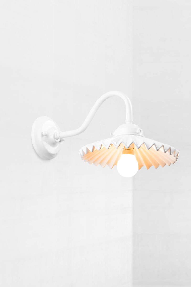 White gooseneck wall arm with an integrated 2 and 1/4 cup, paired with a white ceramic shade. 