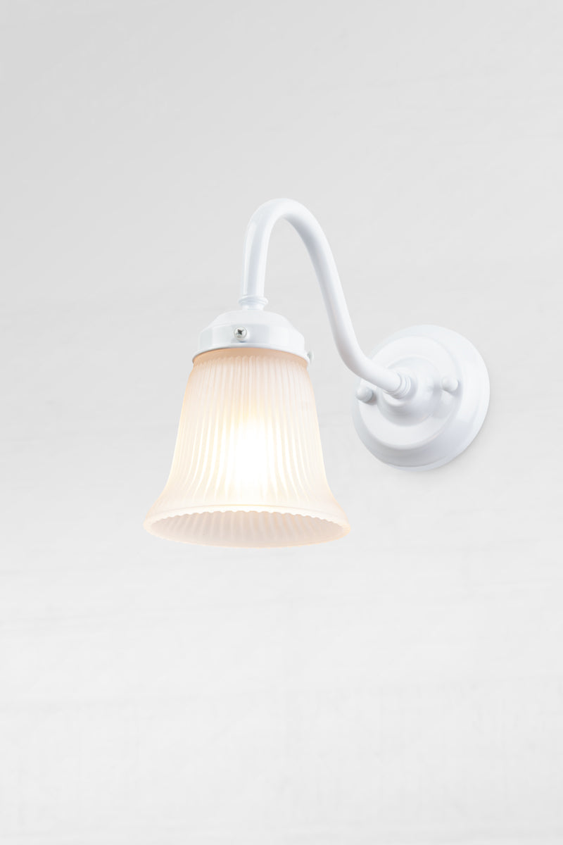 White gooseneck wall sconce with integrated gallery and a small opal ribbed glass shade. 