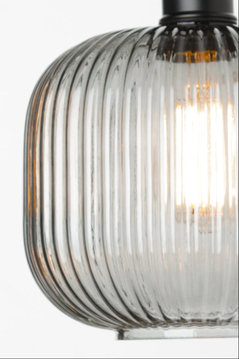 Close-up of smoke grey reeded glass shade on Balmain 3 Light Flush Mount