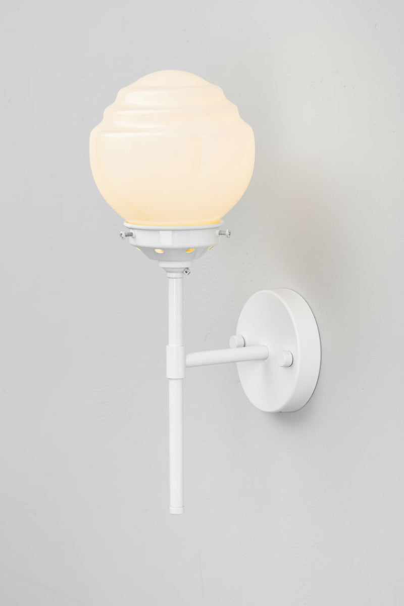 White stem wall light with an opal glass shade