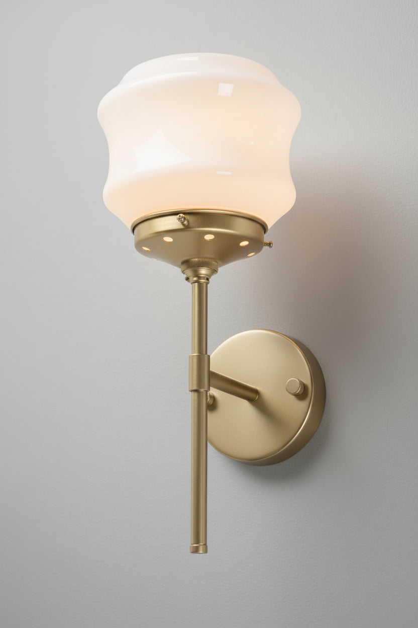 Gold/brass stem wall sconce and an opal glass schoolhouse style shade