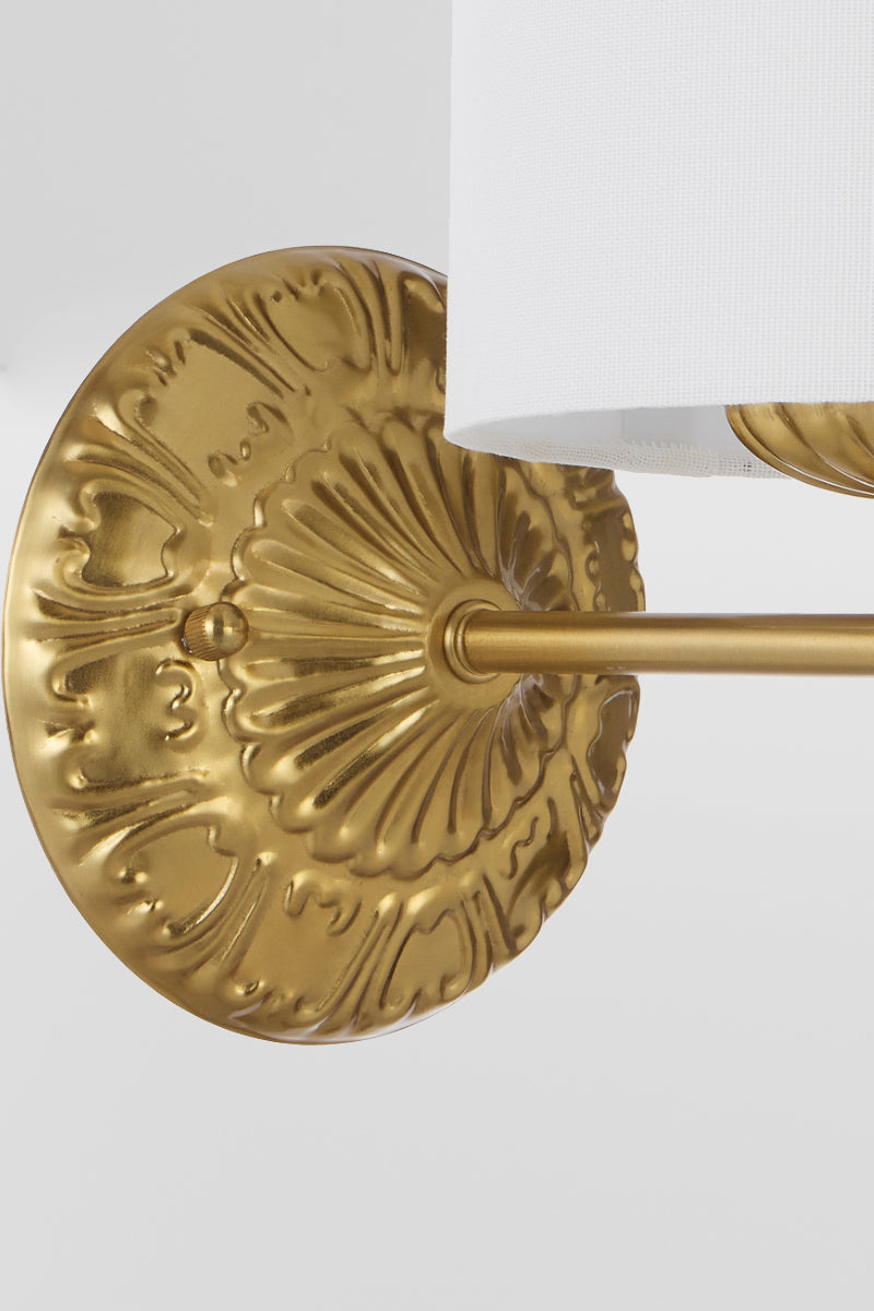 Close up of the detailing on the antique gold wall mount