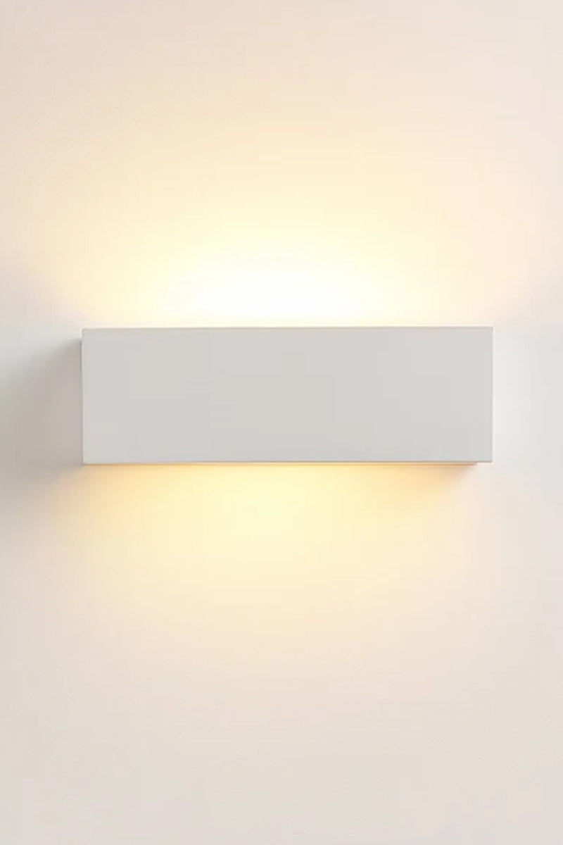 Collaroy Plaster Wall Sconce small size illuminated showing soft up and down wall light.