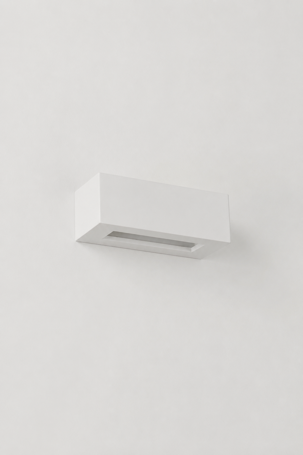 Collaroy Plaster Wall Sconce small size angled side view with paintable plaster finish.
