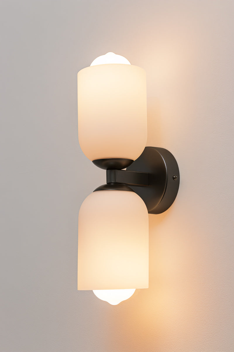 Carlisle Double Glass Wall Light in black with two opal glass shades. Mount vertically to suit your space