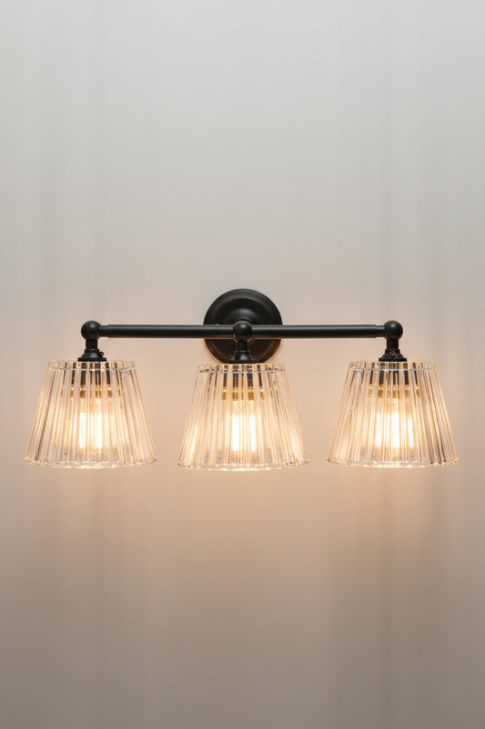 Black Davis Glass Triple Swivel Arm Wall Light with three tapered clear fluted glass shades