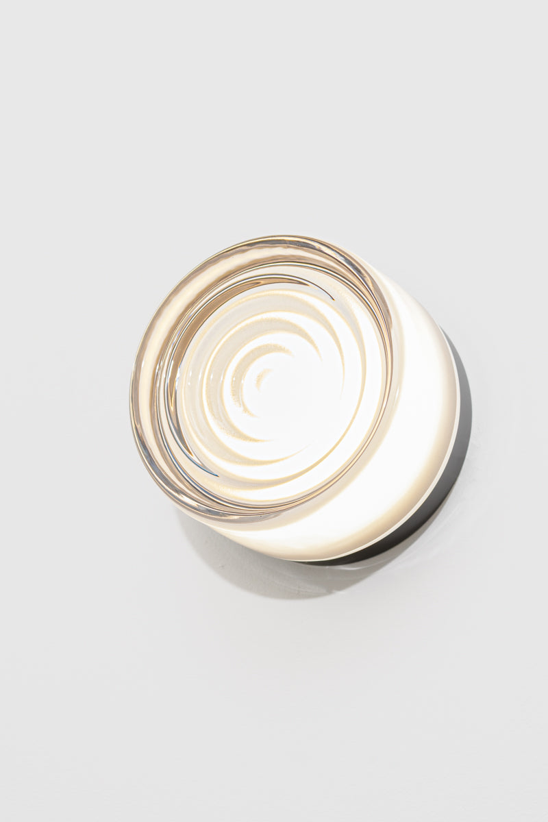Frost LED glass wall light mounted on a white wall with soft diffused illumination and circular glass pattern.