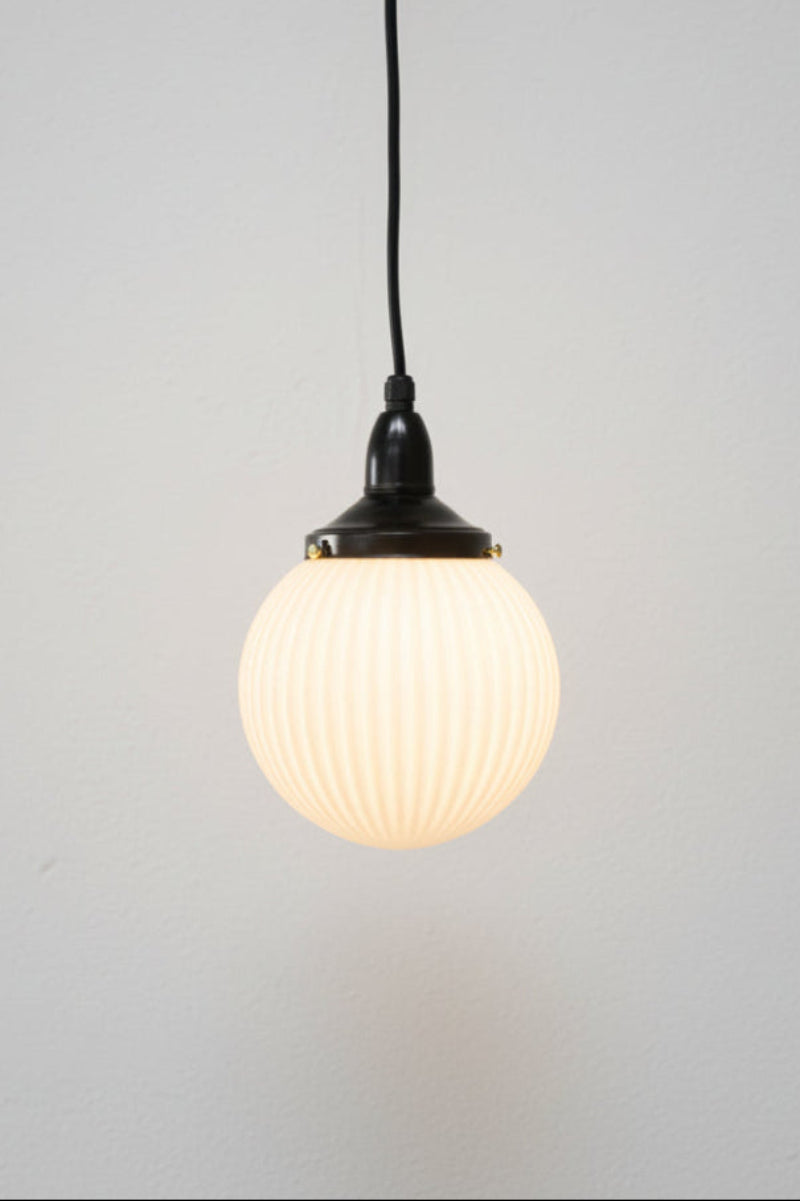 Opal reeded glass shade on a black IP rated pendant cord