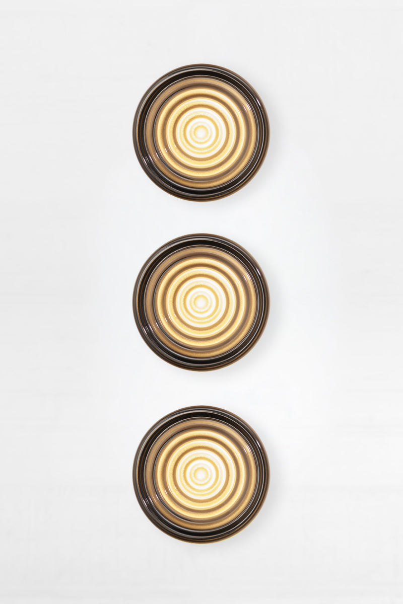 Bundle of three grey LED glass wall lights shown front-on with smoked ribbed glass and warm internal glow.
