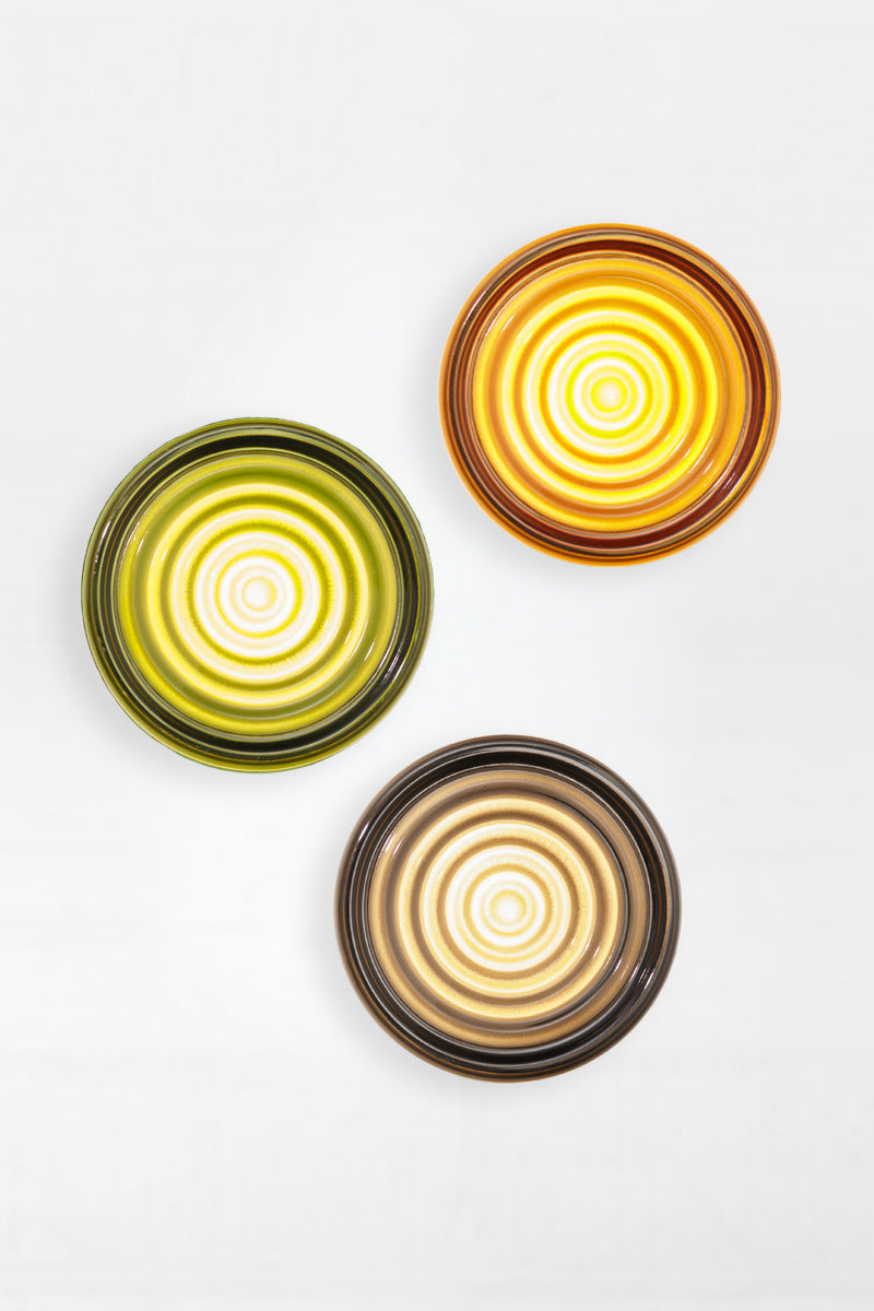 Mixed finish bundle of LED glass wall lights featuring amber, green and grey glass variations in a clustered arrangement.