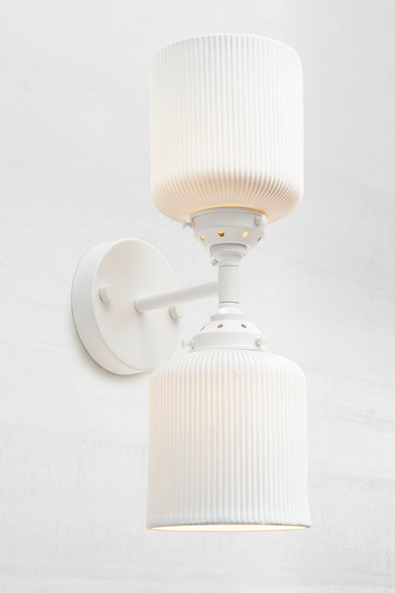 White double wall scone light with matt white ceamic shdes