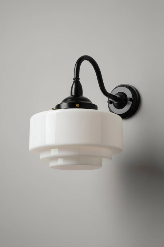 Not illuminated outdoor wall light with an opal glass shade on a black gooseneck wall light. 