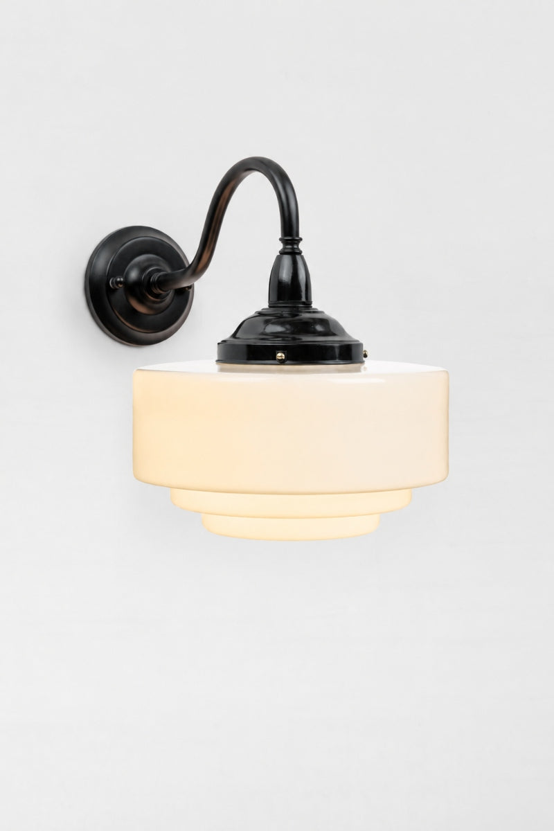 Exterior wall light with a stepped opal glass shade, black bakelite gallery and a metal black gooseneck arm. 