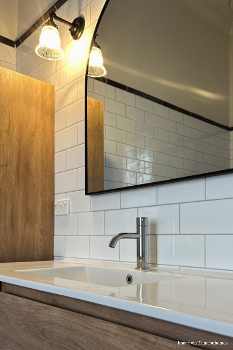 Image via @amconhomes. Black steel wall sconce with a small clear holophane glass shade in a powderVintage and industrial wall light. With a small clear holophane glass shade room. 