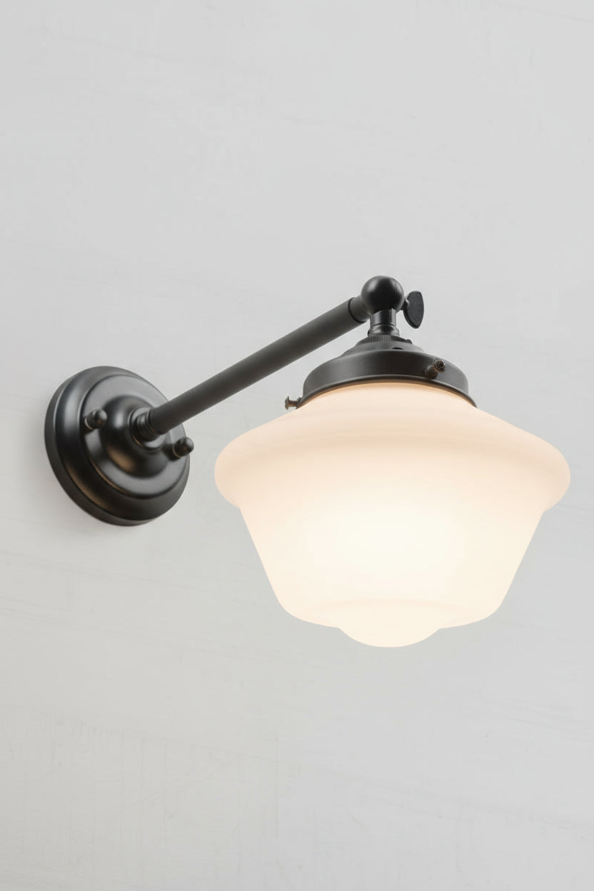 Long adjustable straight arm wall sconce in black paired with the opal glass shade. 