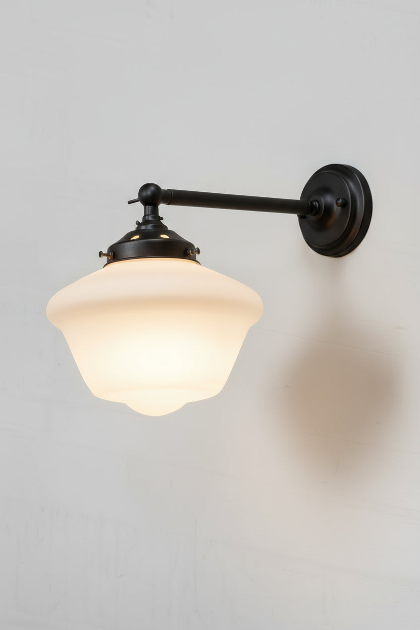 Opal schoolhouse style shade on a long straigh wall arm in black. 