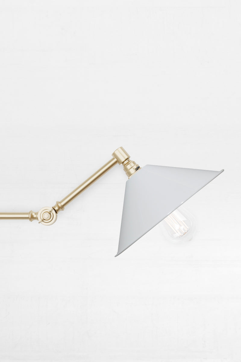 Close up on the Large white shade Swing Gold/Brass Arm.