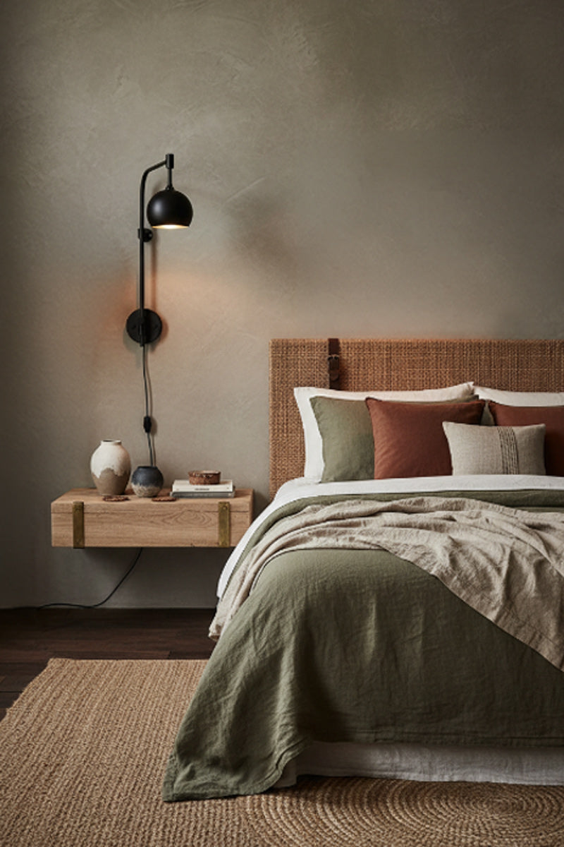 bedroom with wall light used as a reading light