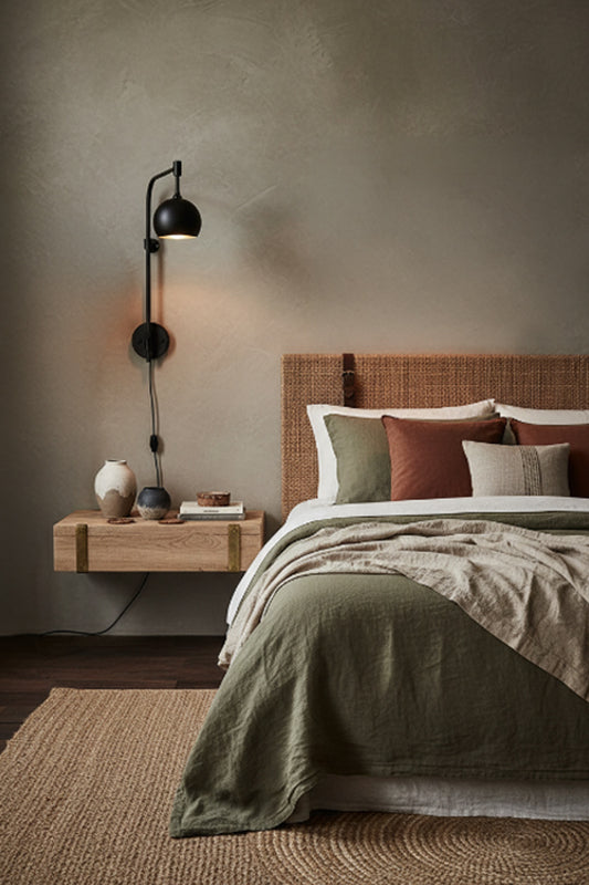 bedroom with wall light used as a reading light