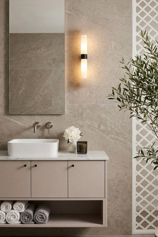 vaniety wall light made from glass and metalware in bathroom at health and well being bathroom next to mirror