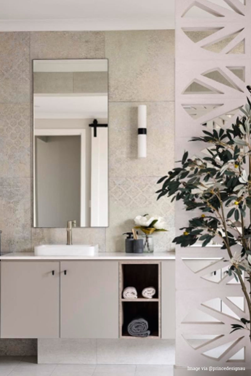 Image via @prinedesignau: Opal tube vanity light with black fixture in a fresh bathroom. 