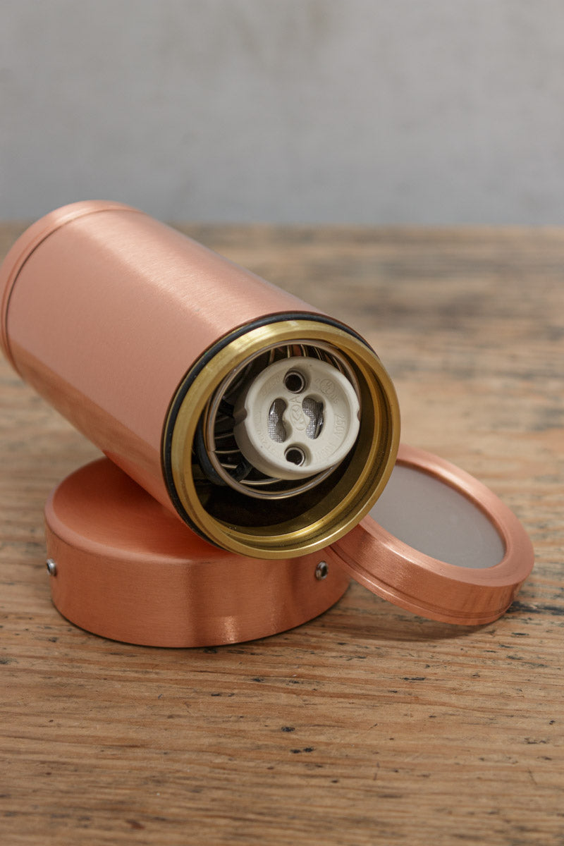 Uninstalled solidg copper up/down wall light showing the GU10 lampholder. 