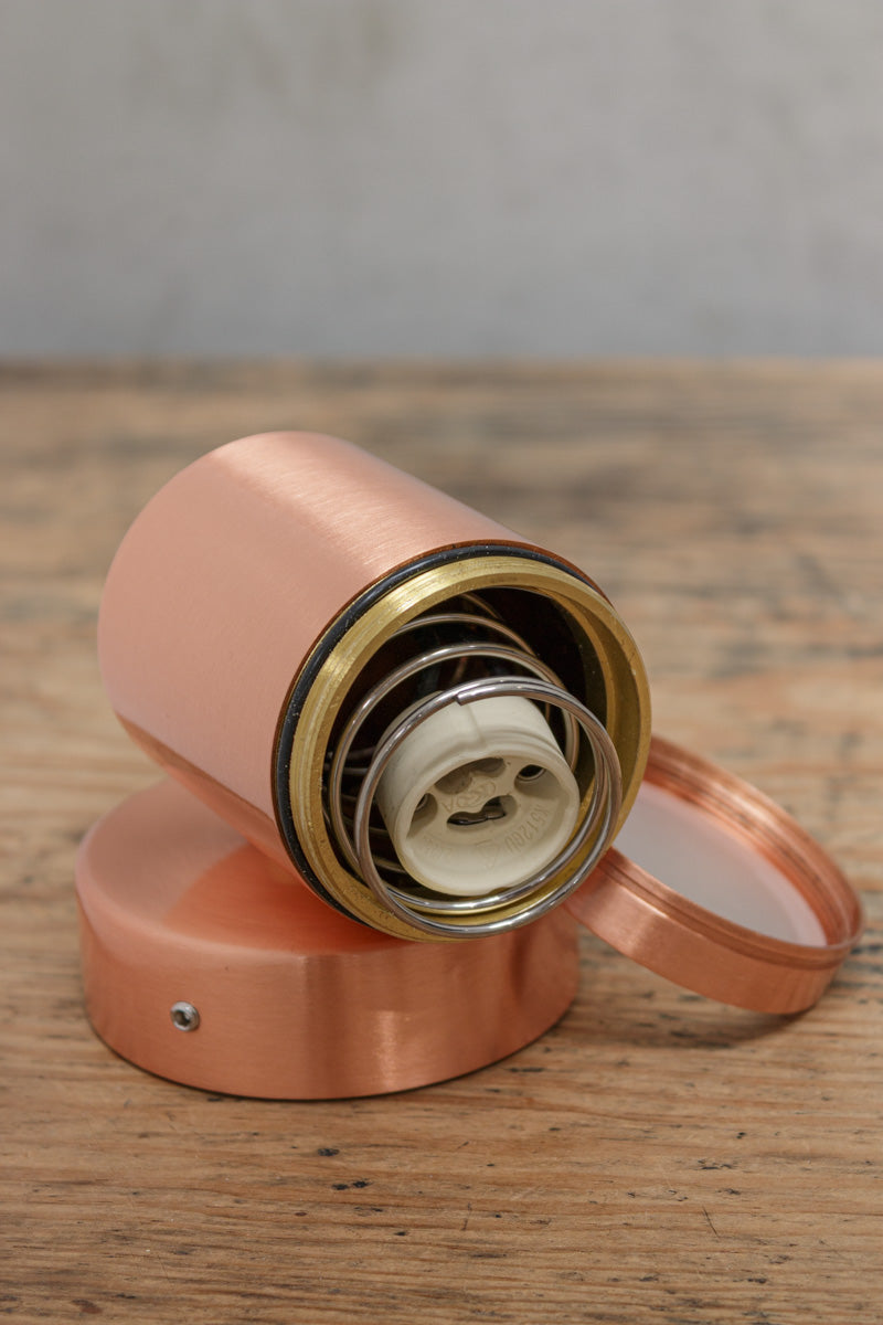 Uninstalled single light, solid copper wall spotlight with polished finish, showcasing GU10 lampholder.