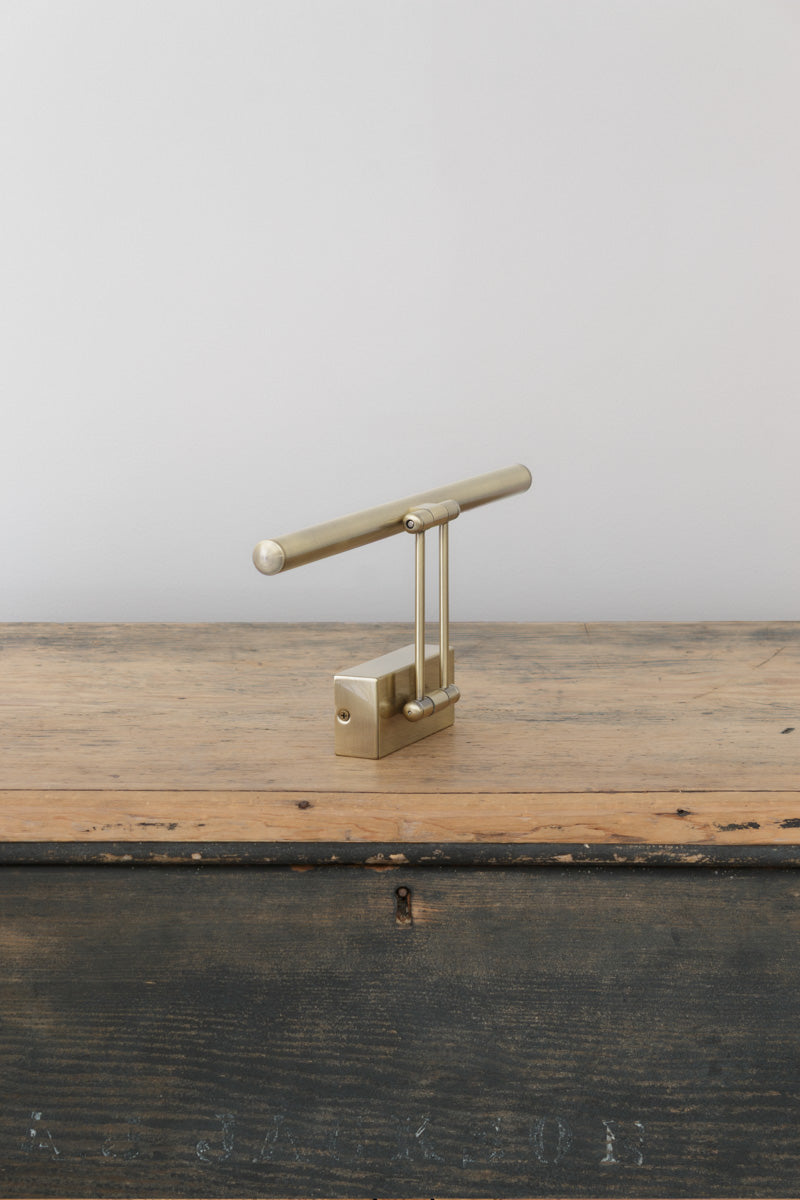 Side view of the small picture light in brass