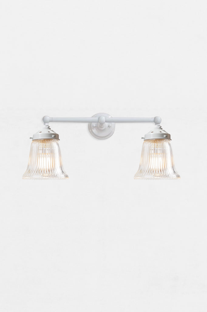 White double arm wall light with clear glass shades