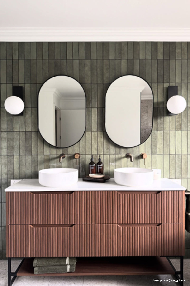 Image via@ur_place: Opal wall lights on rectangle mounting plate hanging either side of a vanity mirrors. 