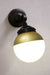 Crown Sphere Swivel Arm Wall Light with a black mounting arm, black gallery and a gold and opal shade