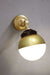 Crown Sphere Swivel Arm Wall Light with a gold mounting arm, gold gallery and a gold and opal shade